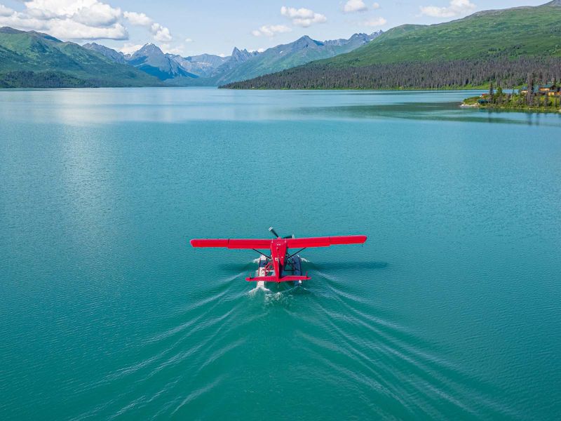 Turbine Dehavilland Beaver taking off on Chelatna Lake 